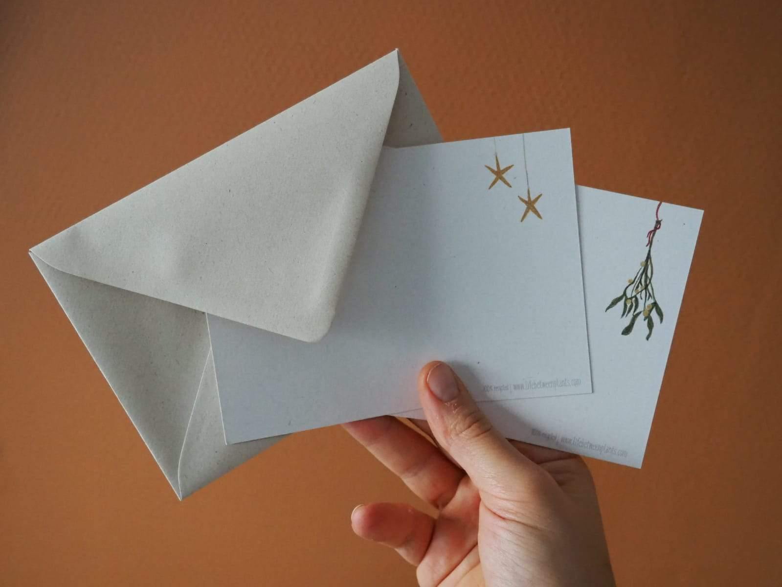 Foto van de achterkant van de kerstkaartjes en envelop